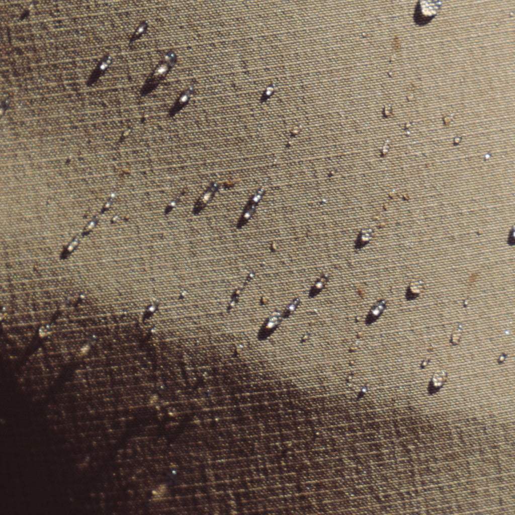 life-style-image Close-up of the texture and detail on Roark's Hytide Hybrid Shorts in dark khaki, featuring water-repellent fabric and versatile design for adventure and travel. Big Image - 5