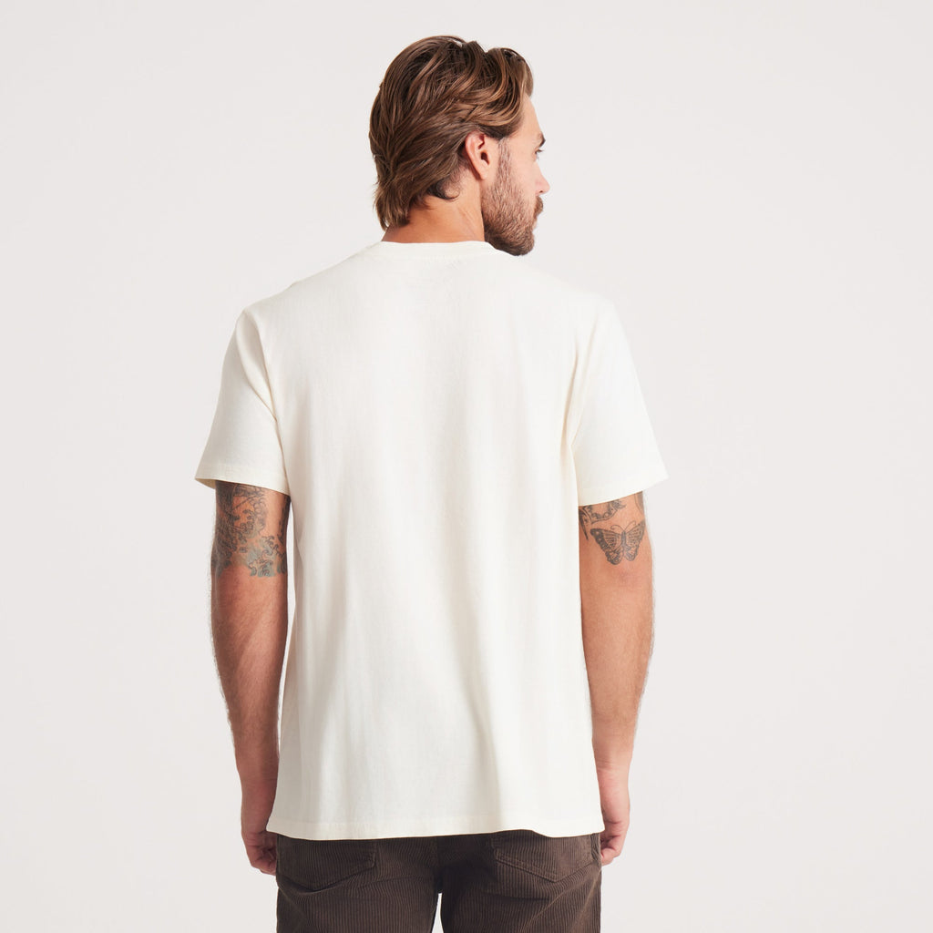 The back view of the man in a white Roark t-shirt, highlighting a relaxed fit, perfect for everyday wear. Big Image - 4
