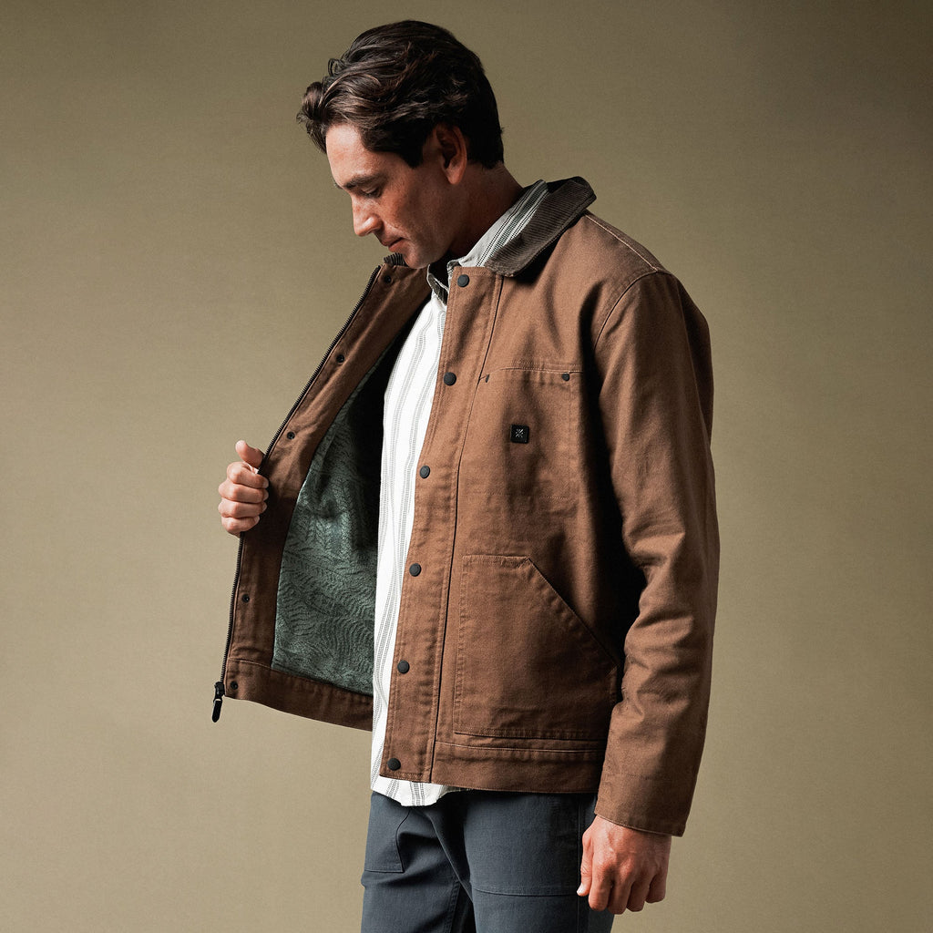 Waxed canvas jacket by Roark laid out on open road, embodying adventure and rugged outdoor style for fall 2025 collection Big Image - 2