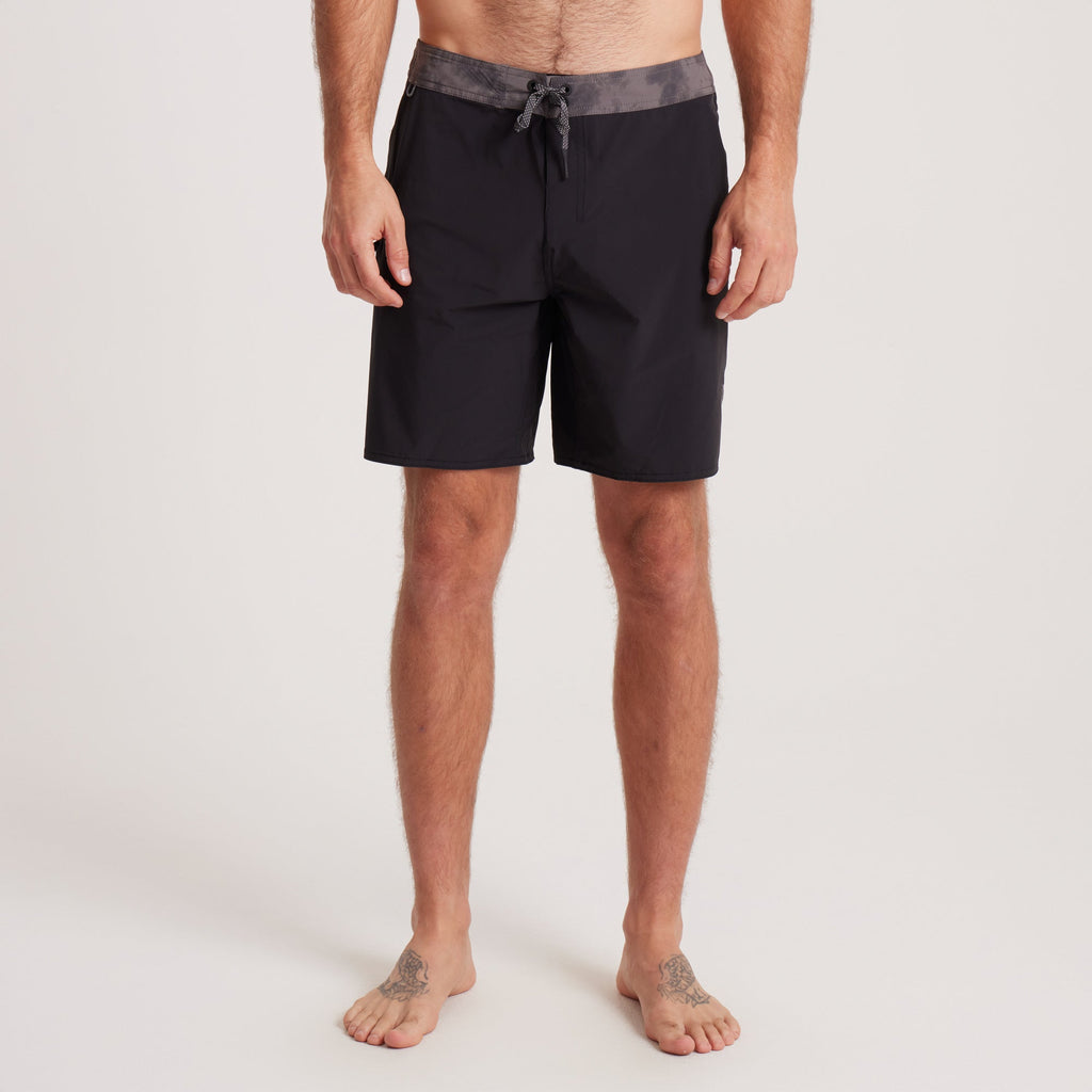 Front view of black Roark boardshorts with a grey waistband, designed for comfort, durability, and water performance. Big Image - 2