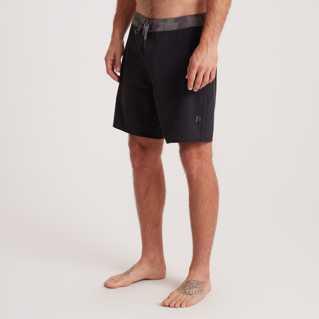 Side view of Roark black boardshorts highlighting sleek design and functional details, perfect for outdoor adventures. Big Image - 3