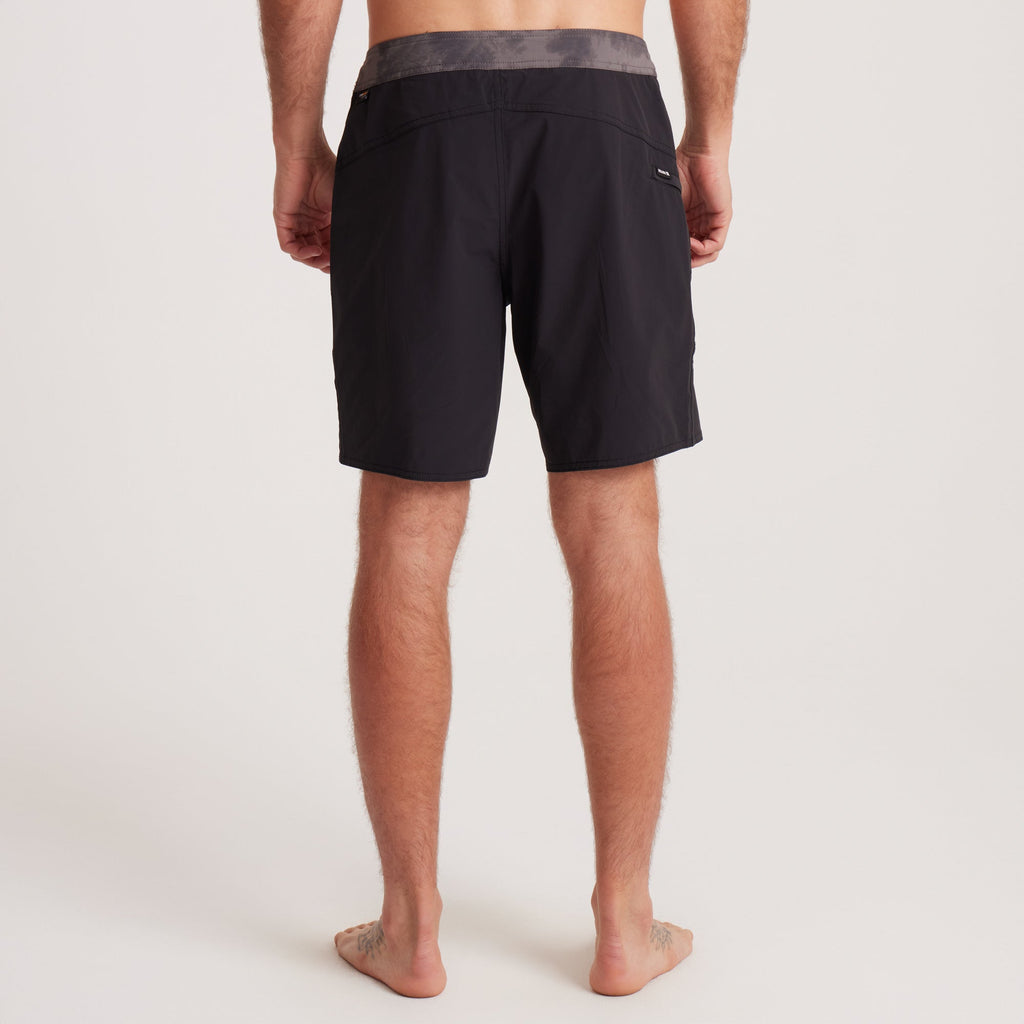 Back view of Roark black boardshorts showcasing a grey waistband and zippered pocket for utility and style. Big Image - 4