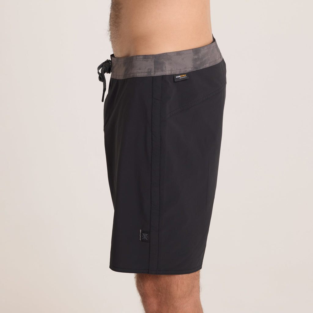 Detailed side view of Roark black boardshorts, blending a minimalistic design with high-performance fabric for water and outdoor activities. Big Image - 6