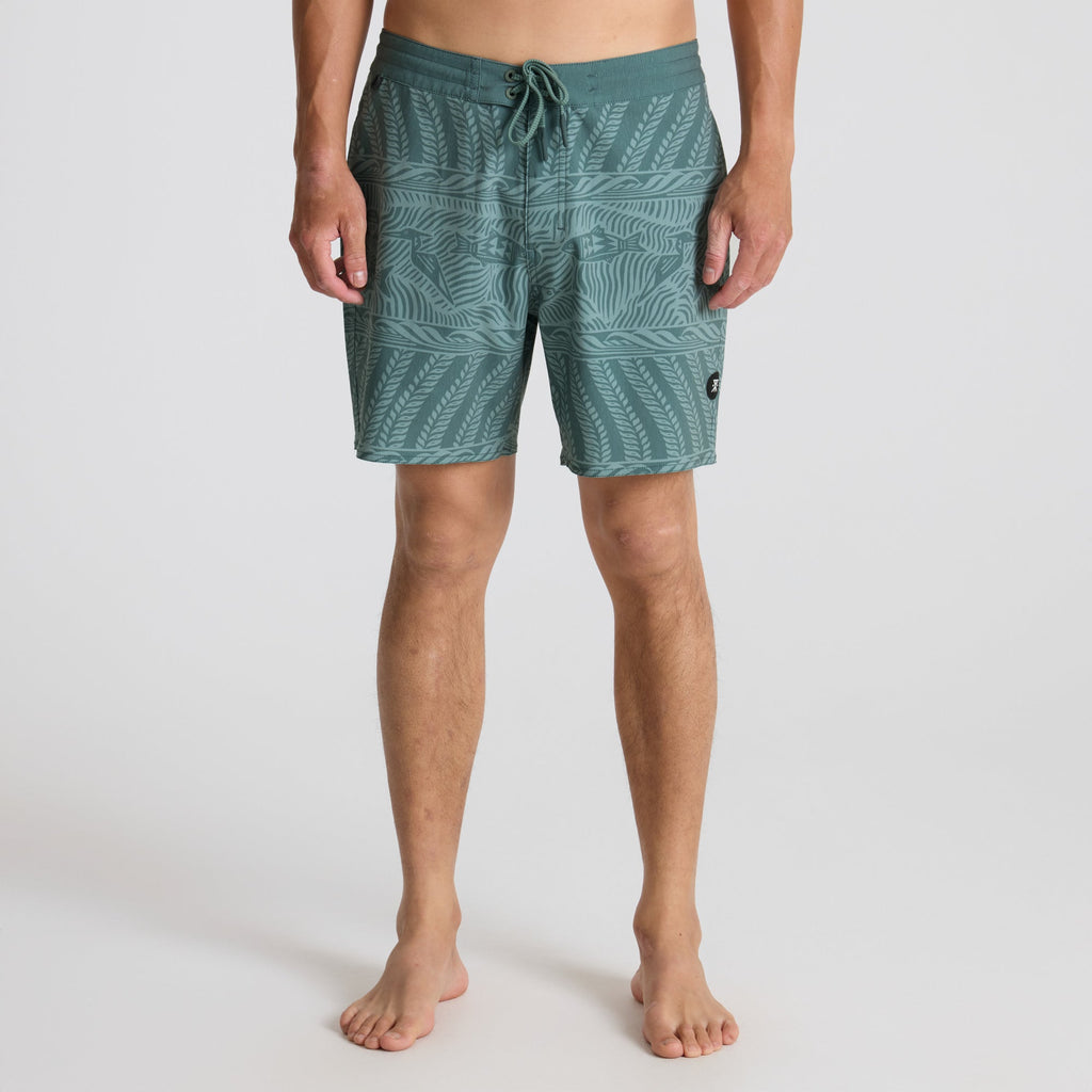 Stylish Roark boardshorts and trunks designed for outdoor adventures and tropical escapades, displayed in a natural setting. Big Image - 2
