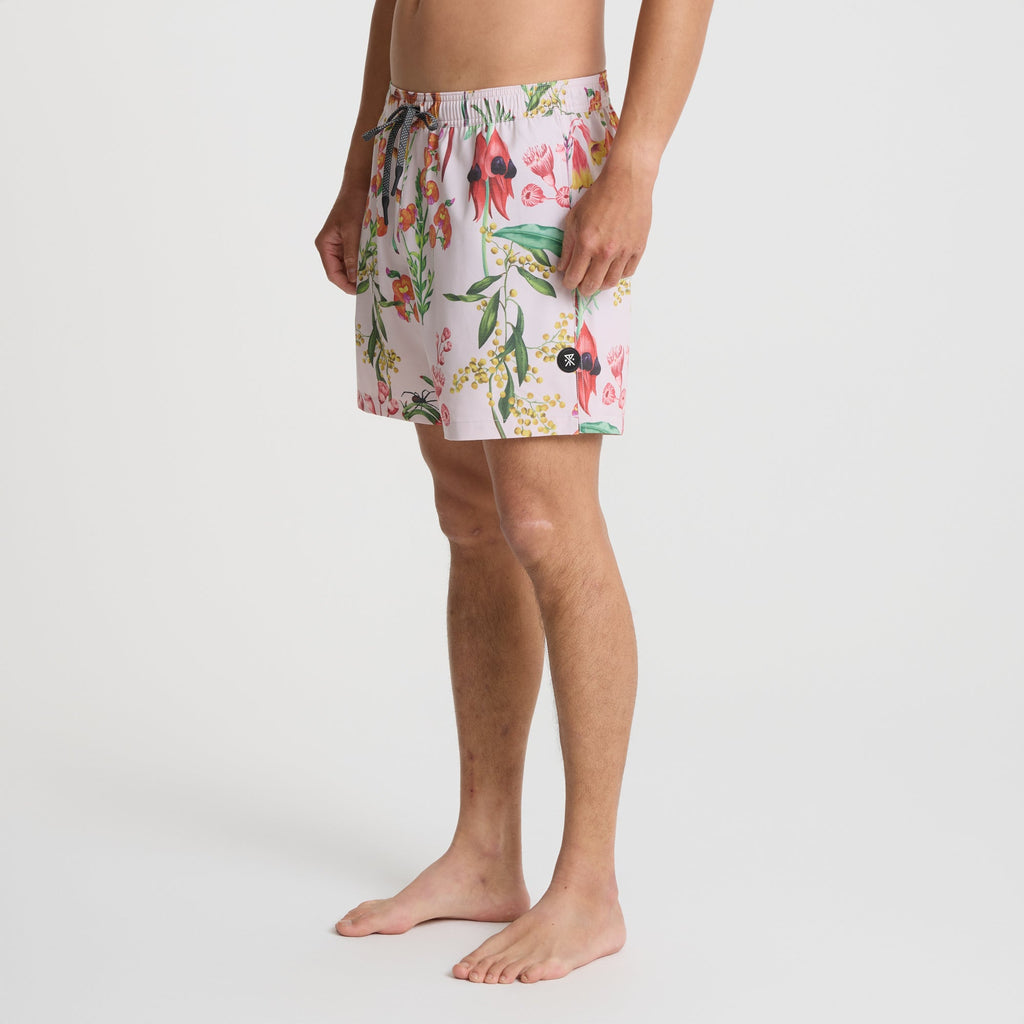 Assorted Roark boardshorts and swim trunks designed for adventure and leisure activities, displayed in an outdoor setting. Big Image - 3