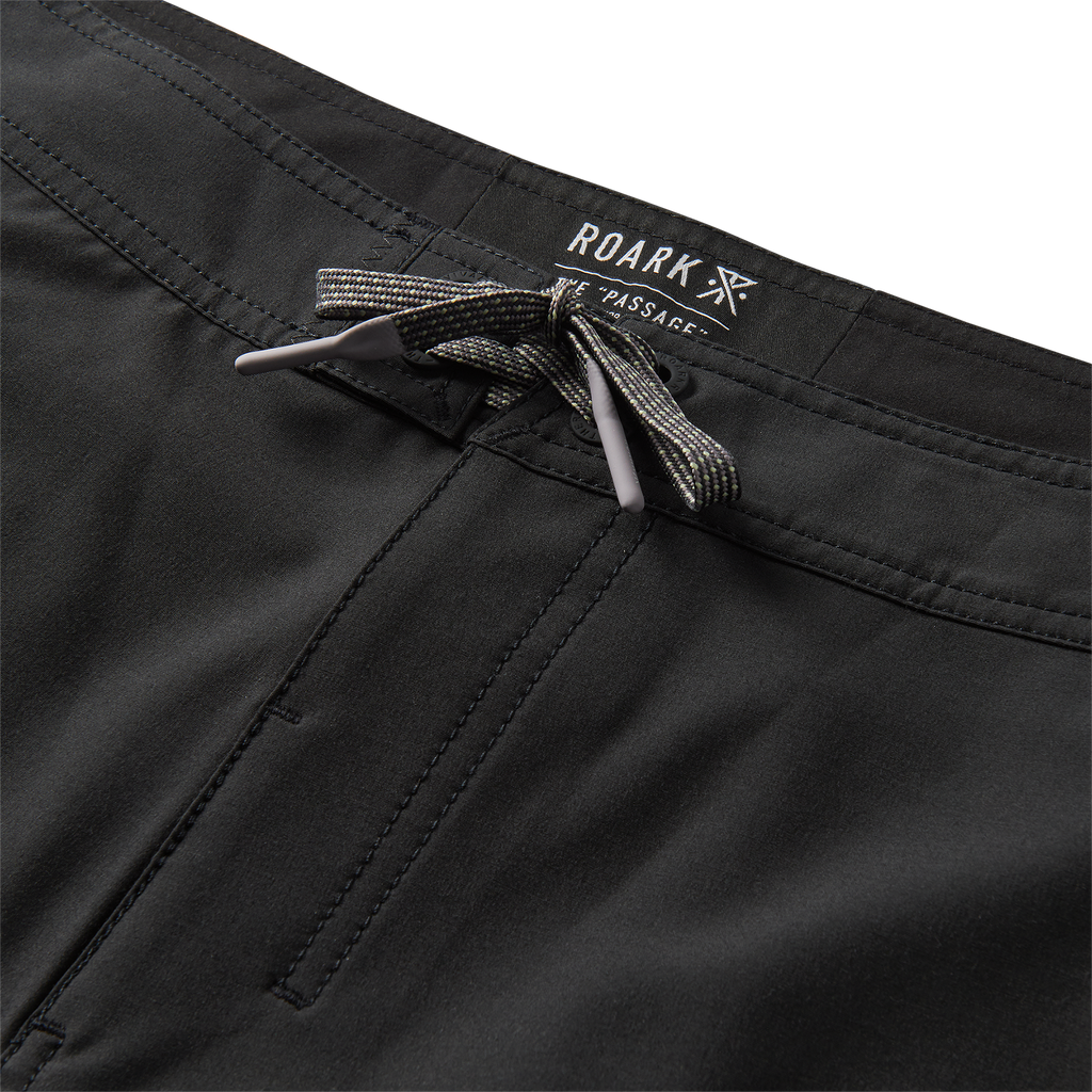 Drawstring waistband detail of black active shorts with printed sides for a secure and stylish fit. Big Image - 10