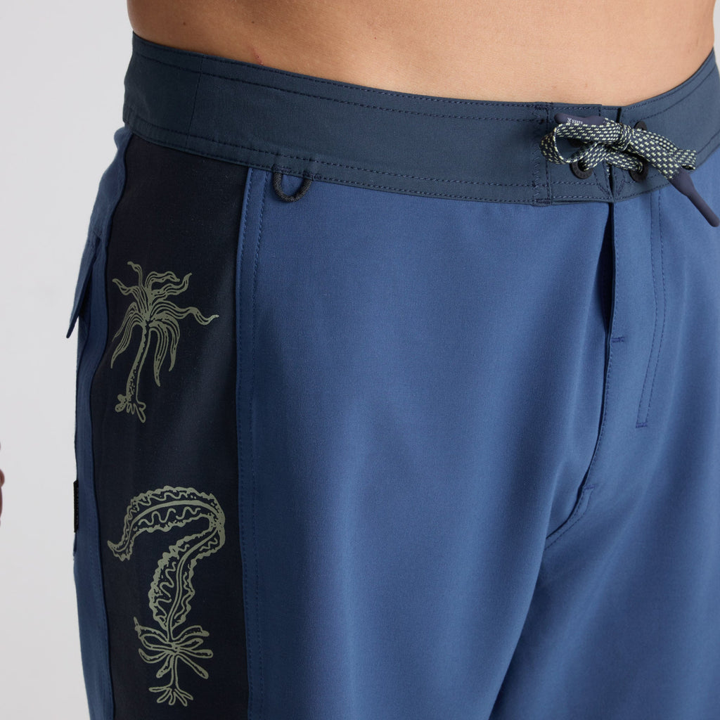 Bermuda shorts and wetsuit on display, showcasing Roark's adventure-ready apparel for diverse outdoor activities. Big Image - 5