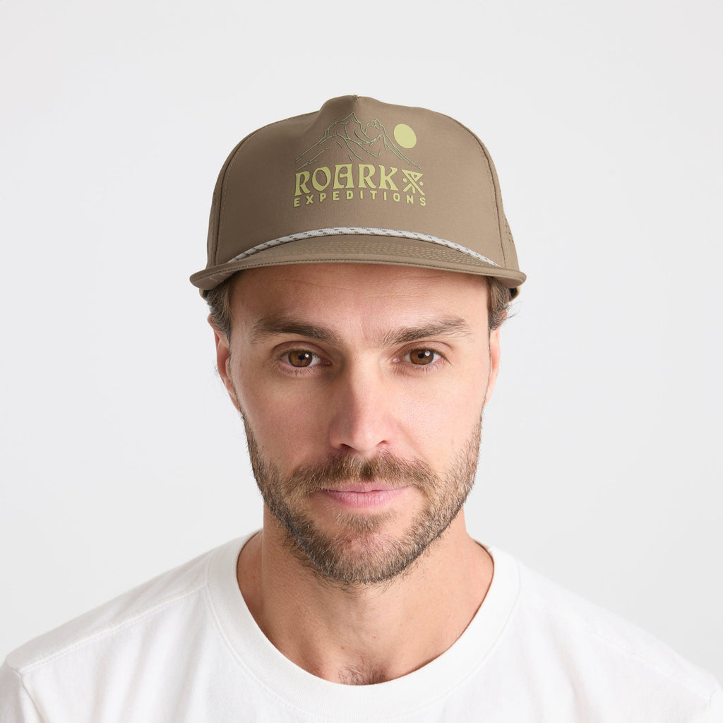 Man wearing a stylish cricket cap with subtle facial hair, embodying Roark's adventurous and outdoor spirit. Big Image - 2