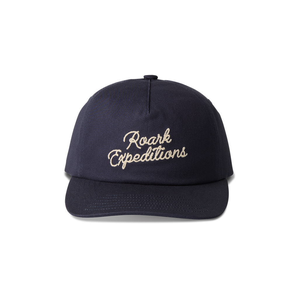 Roark navy baseball cap with logo on the front, designed for adventure and travel. Big Image - 1