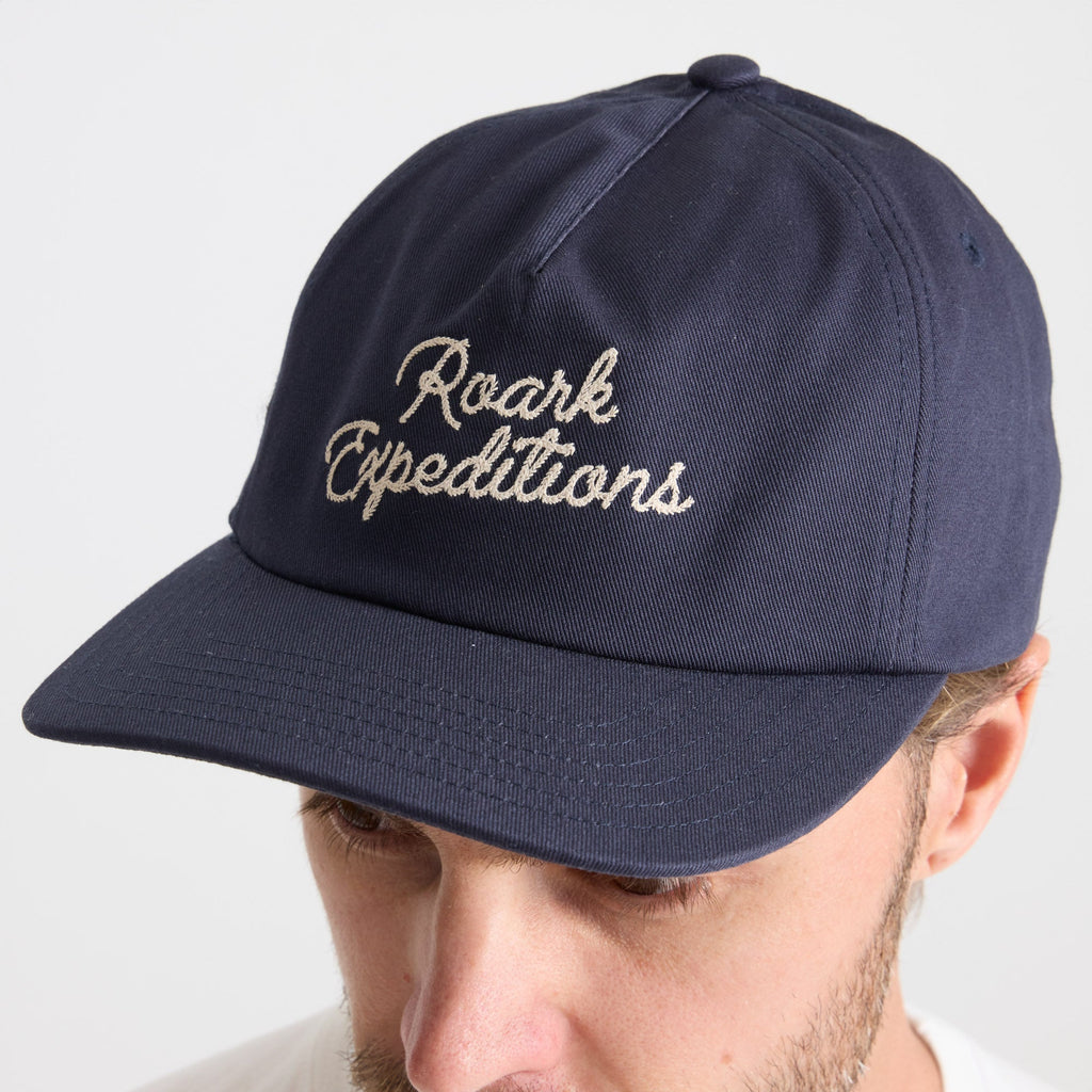 Stylish navy blue baseball cap perfect for outdoor adventures and travel, part of Roark's gear collection. Big Image - 4