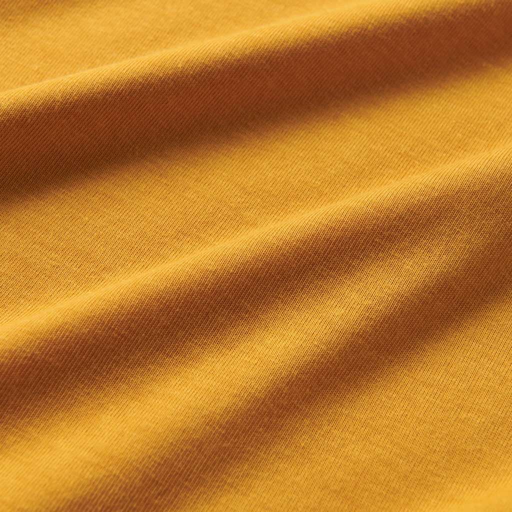 A close-up image of the Roark Mathis Core Short Sleeve Tee in gold, showcasing the details and craftsmanship. Shop the official Roark store now. Big Image - 4