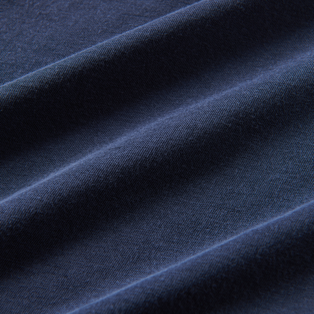 A close-up image of the Roark Made To Fade Short Sleeve Tee in Washed Navy, showcasing the details and craftsmanship. Shop the official Roark store now. Big Image - 4