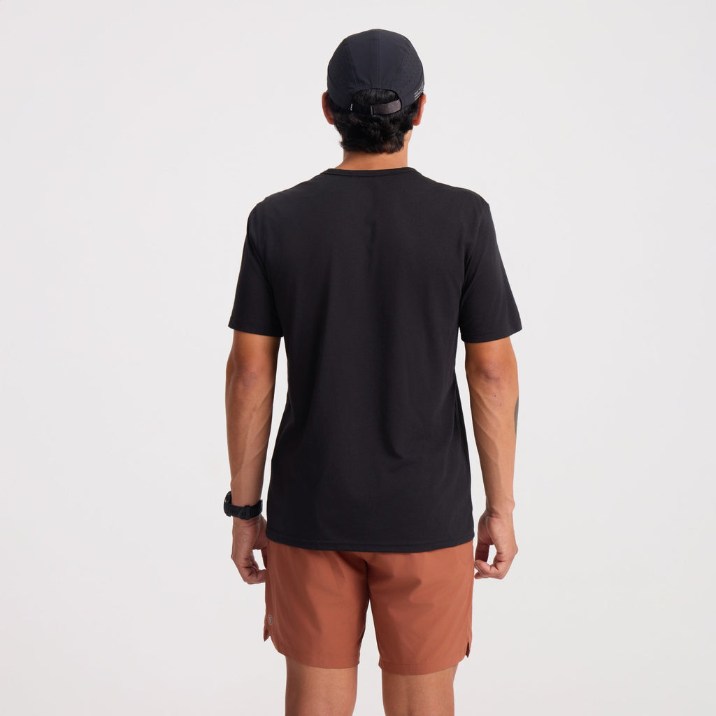 Active black shirt designed for adventure and outdoor activities, displayed in a natural setting. Big Image - 6