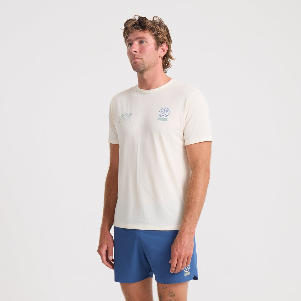 Active man wearing blue Roark sleeve shirt paired with boardshorts in an outdoor adventure setting Big Image - 3