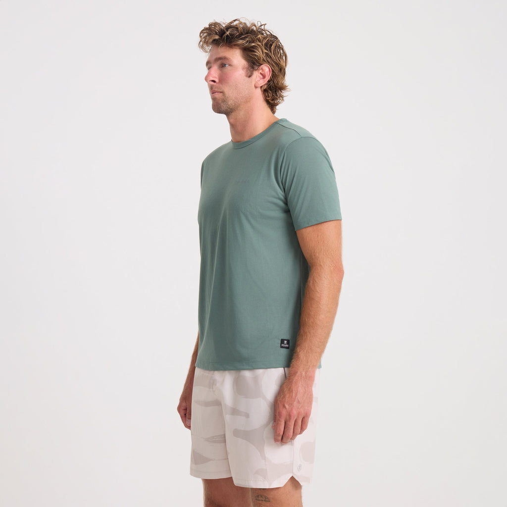 Active male adventurer wearing a versatile Roark shirt, focusing on the shirt's elbow, waist, and shoulder details, ideal for outdoor activities. Big Image - 3