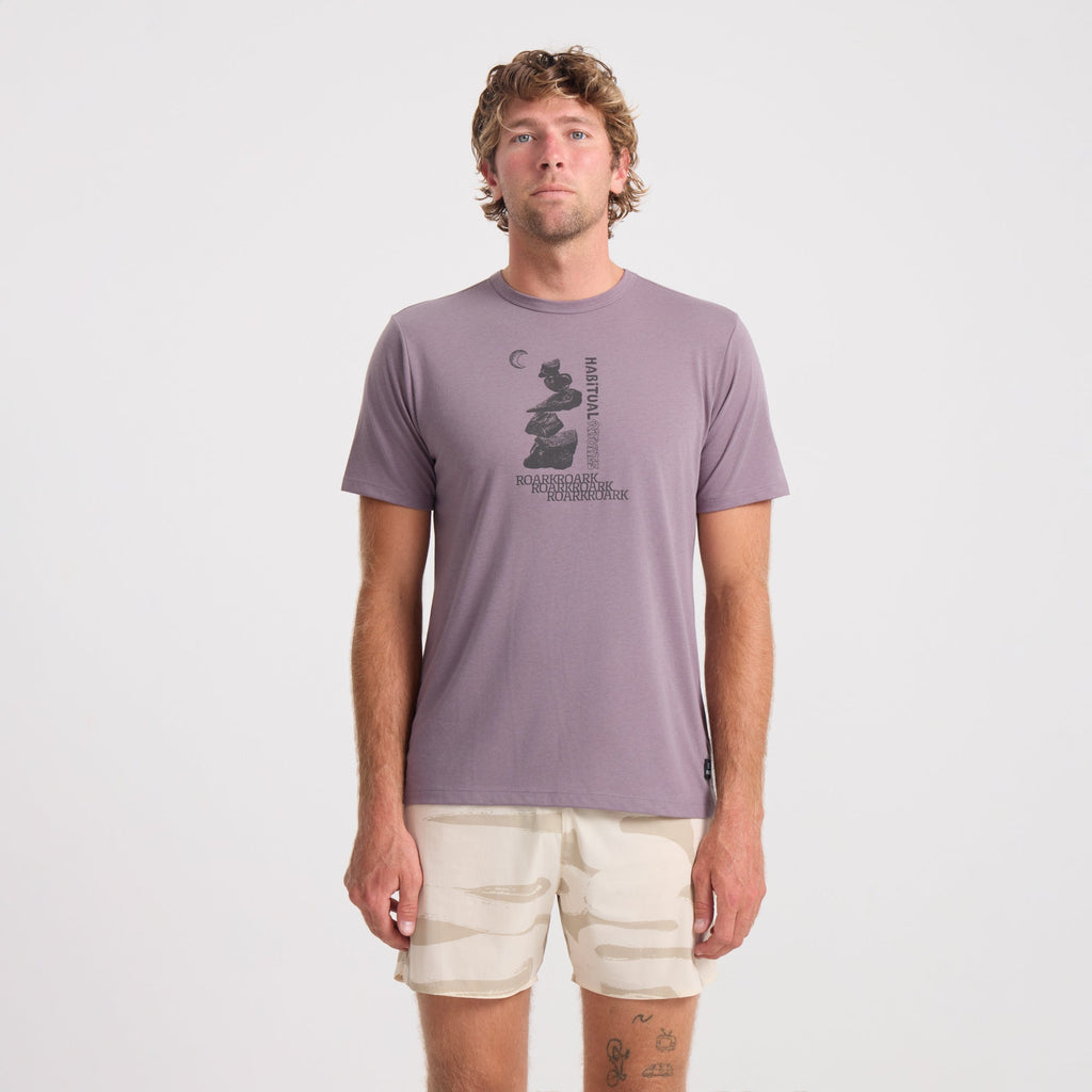 Active man wearing a Roark long sleeve performance shirt, ideal for outdoor adventures and travel. Big Image - 2