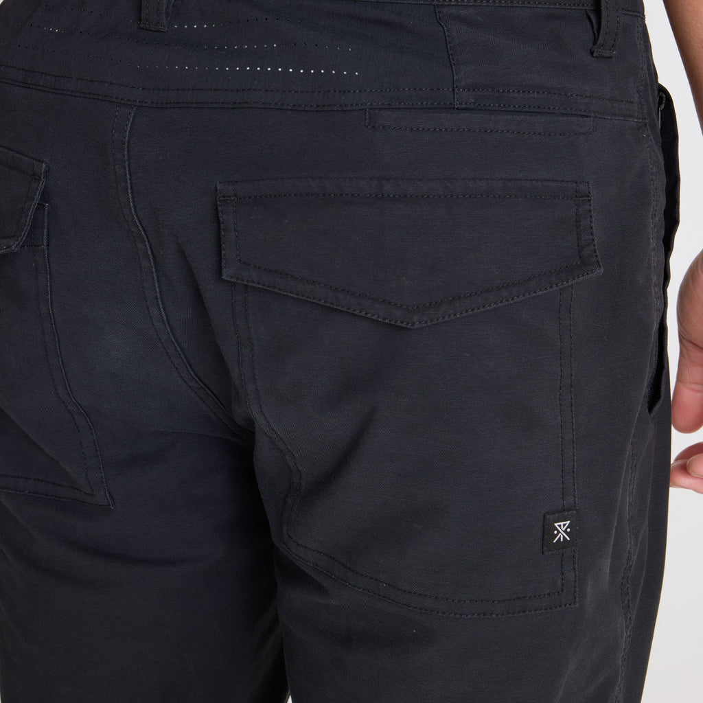 Roark adventure-ready black cargo pants styled for outdoor exploration and travel, showcasing durability and functionality. Big Image - 7