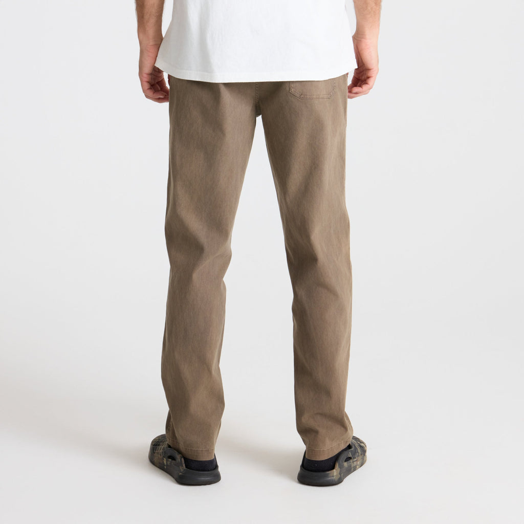 Close-up of the detailed craftsmanship on Roark's khaki pants featuring a pocket, ideal for adventure travel, paired with durable walking shoes. Big Image - 5