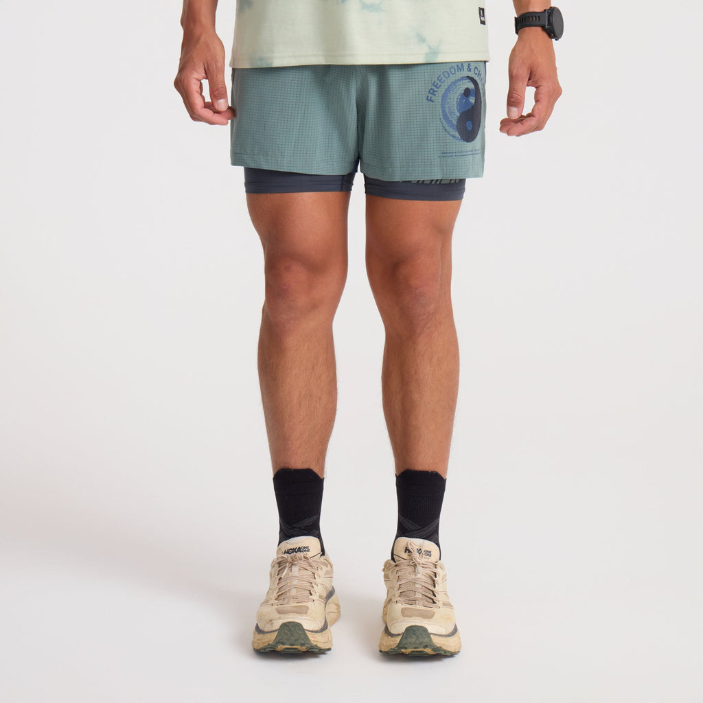 Bermuda and board shorts on display, ideal for adventure and travel by Roark. Big Image - 2