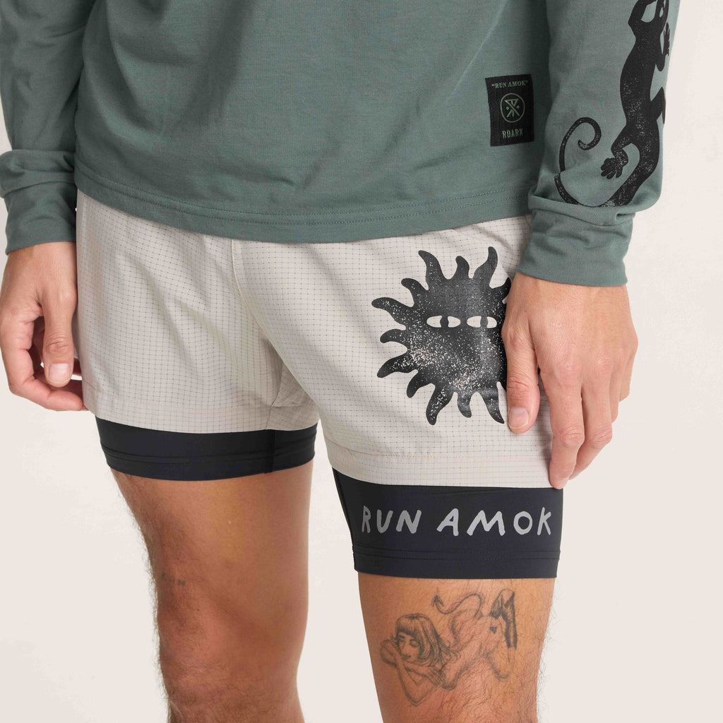 Front view of Roark running shorts with bold sun graphic and integrated black liner for added comfort and support during activities. Big Image - 9