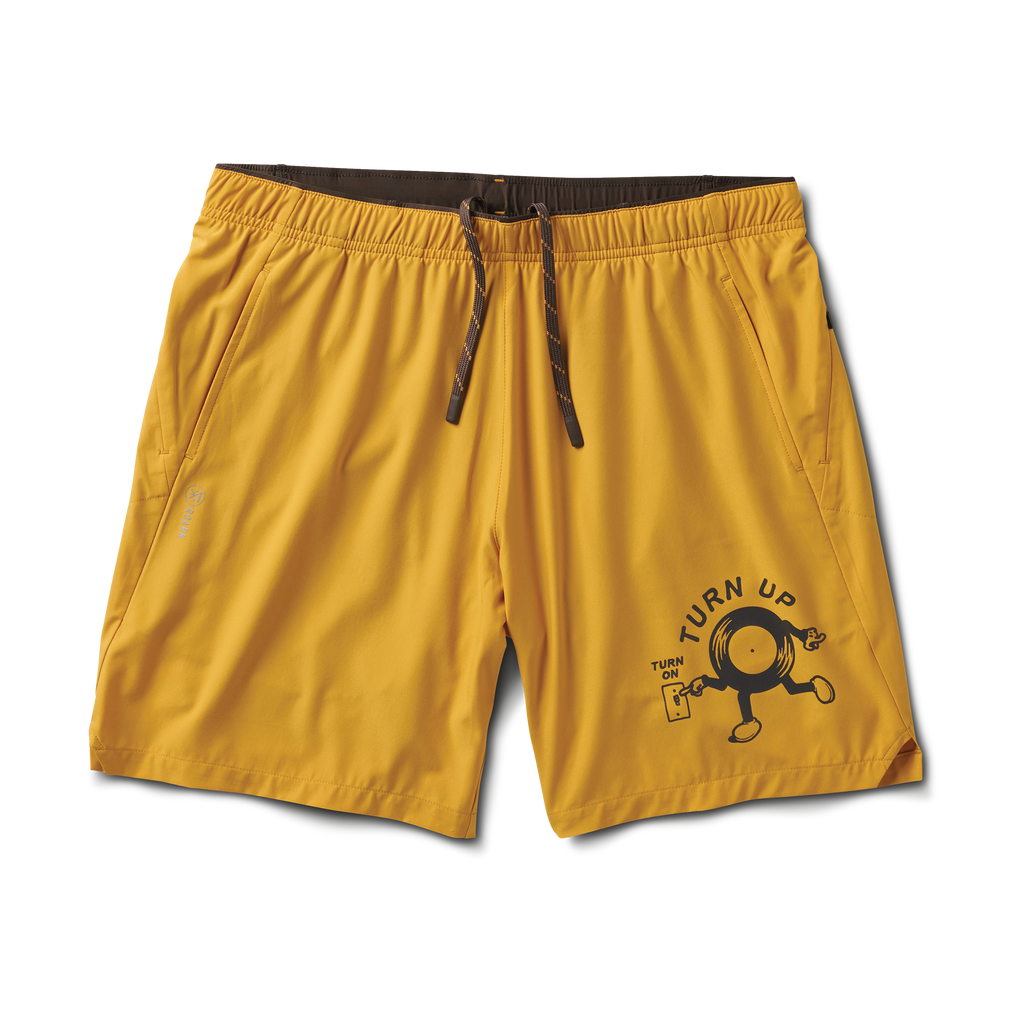 Detail shot of the Roark Bommer 2.0 7" Shorts in Gold, highlighting their vibrant color and relaxed fit. Big Image - 1