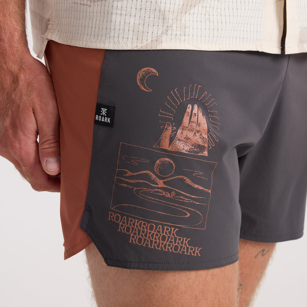 Adventure-ready boardshorts by Roark, styled for both water and leisure, with surrounding boating equipment enhancing the outdoor travel vibe. Big Image - 5