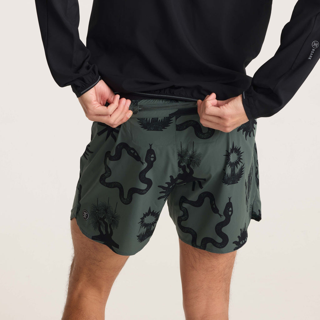 Rear waistband view of green printed running shorts, showcasing secure pocket and modern design for outdoor activities. Big Image - 6