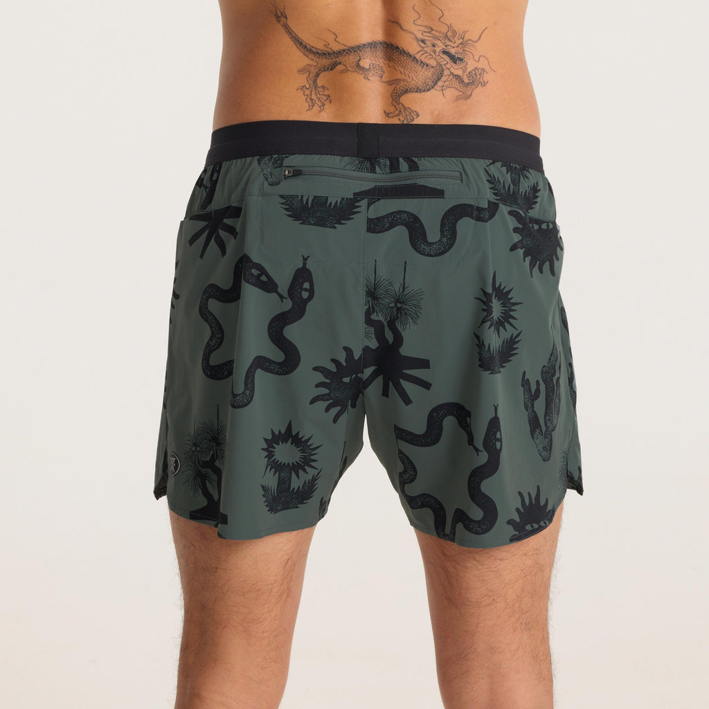 Profile view of green printed running shorts, highlighting bold graphics and a relaxed fit for ultimate comfort. Big Image - 7