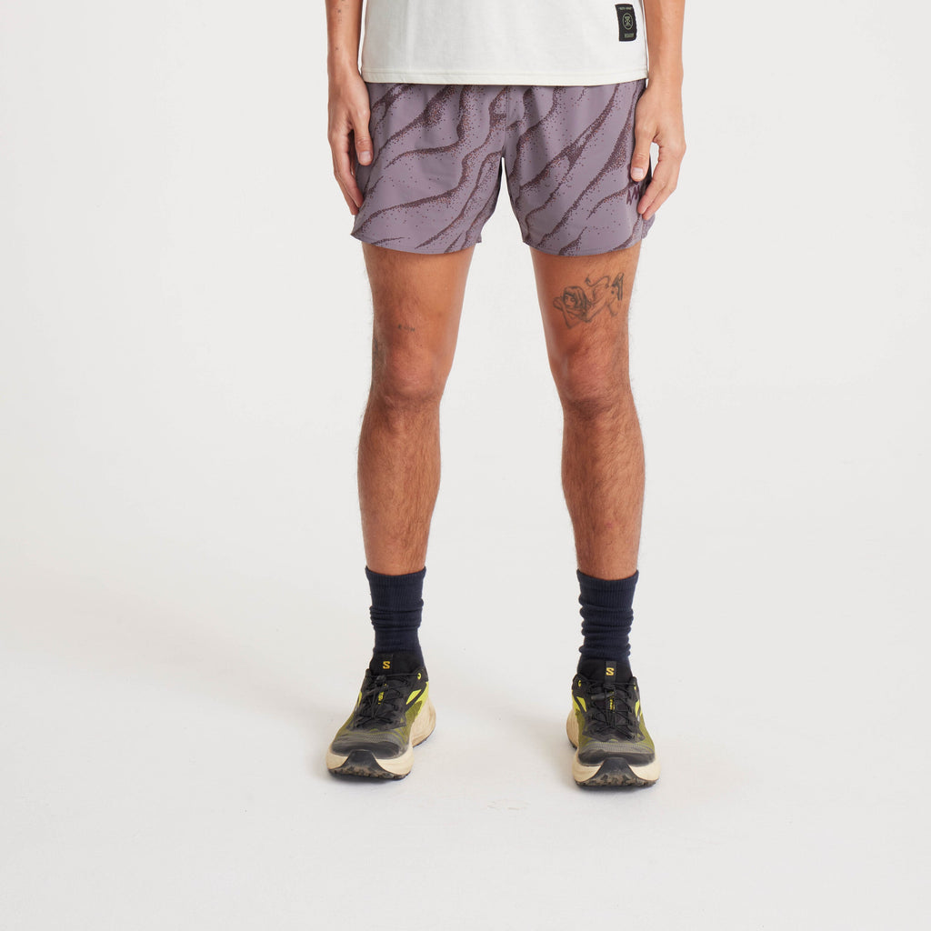 Front view of running shorts showcasing lightweight material, purple wave pattern, and active fit designed for mobility. Big Image - 2