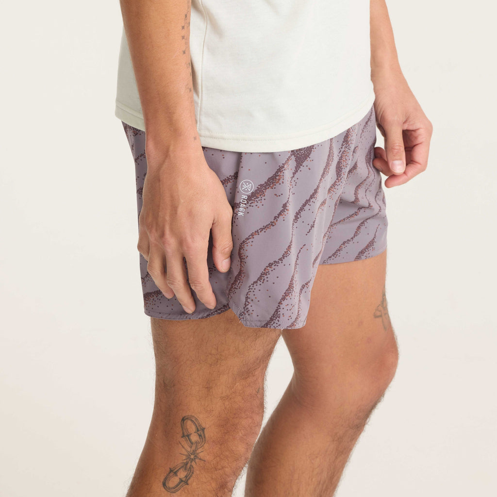 Close-up of men's performance running shorts with stylish purple wave pattern and side logo detail for premium comfort and style. Big Image - 8