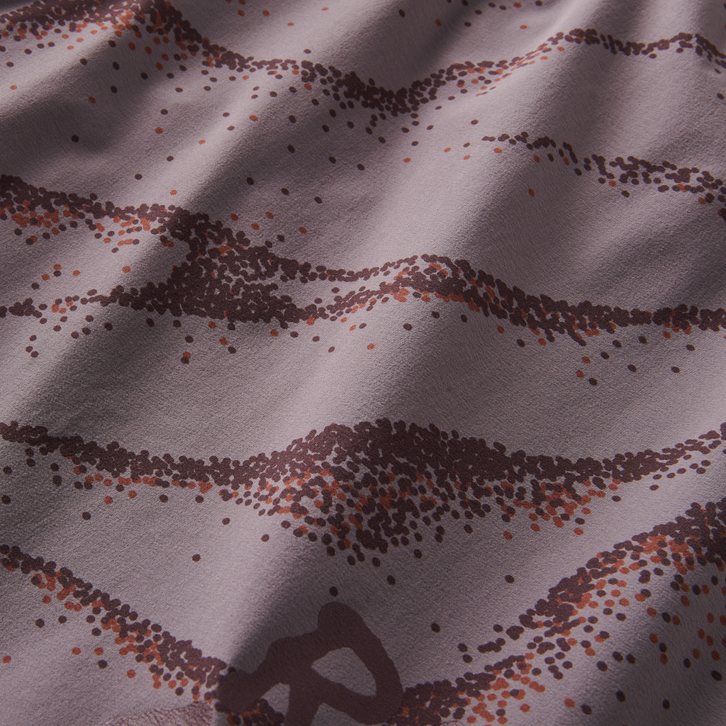 Zoomed-in view of unique dotted purple pattern on breathable running shorts fabric for enhanced airflow and comfort. Big Image - 13