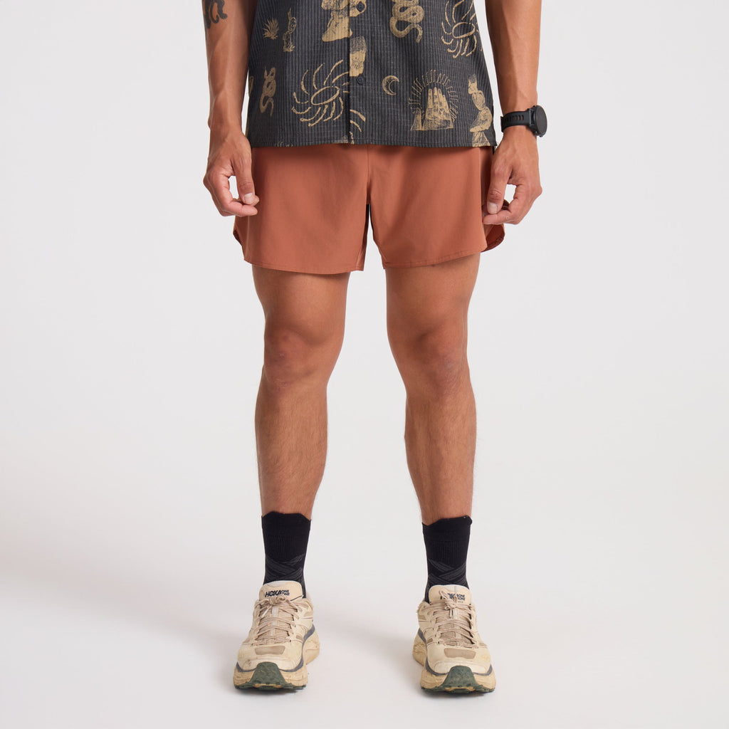 Assortment of Roark adventure-ready shorts including active shorts, boardshorts, Bermuda shorts, and trunks, displayed with a view of a calf, embodying the spirit of outdoor exploration and travel. Big Image - 2