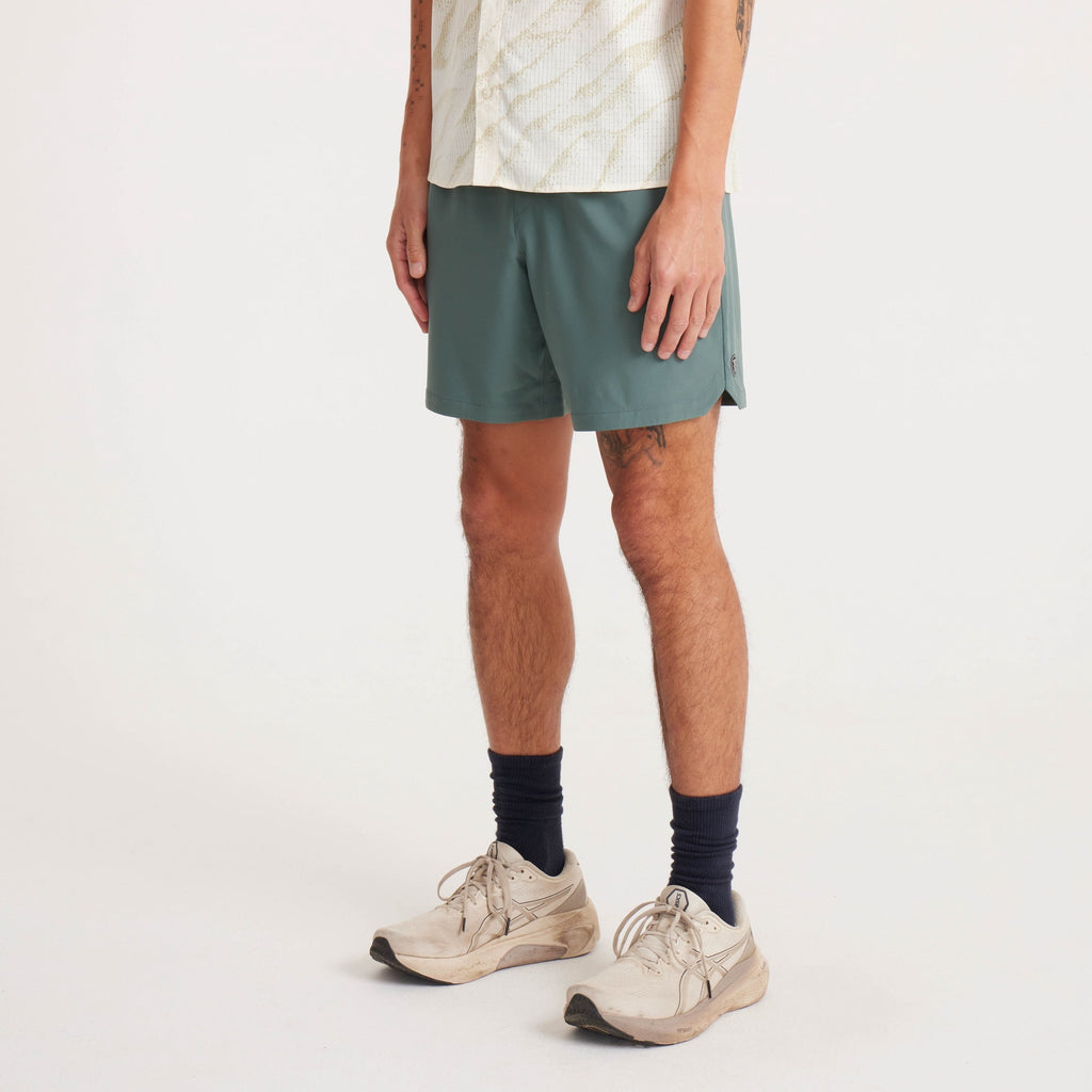 Front view of men's green shorts with an athletic fit and lightweight, breathable fabric for maximum comfort. Big Image - 3