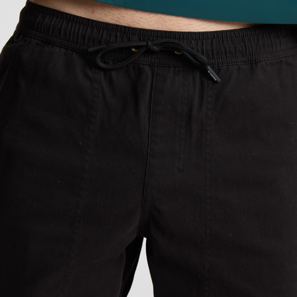 Adventure-ready man wearing Roark outdoor gear exploring a rocky landscape Big Image - 5