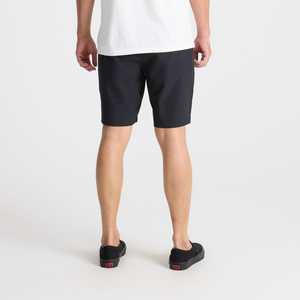 Adventurous calf wearing bermuda shorts and walking shoes in an outdoor setting, embodying Roark's spirit of exploration and travel. Big Image - 4