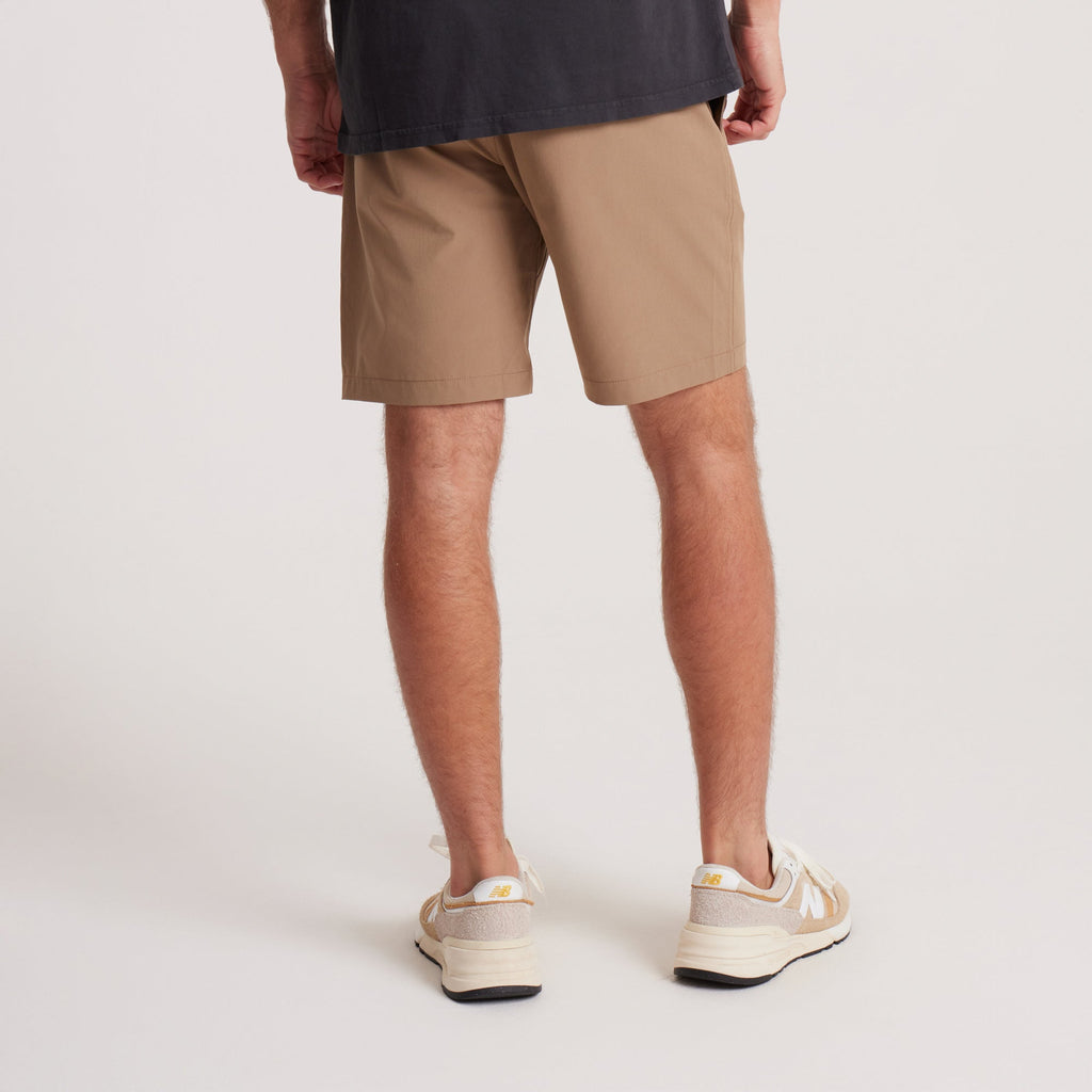 on-model Back view of men's tan hybrid shorts, featuring a relaxed fit and clean seams, perfect for outdoor adventures or casual wear. Big Image - 8