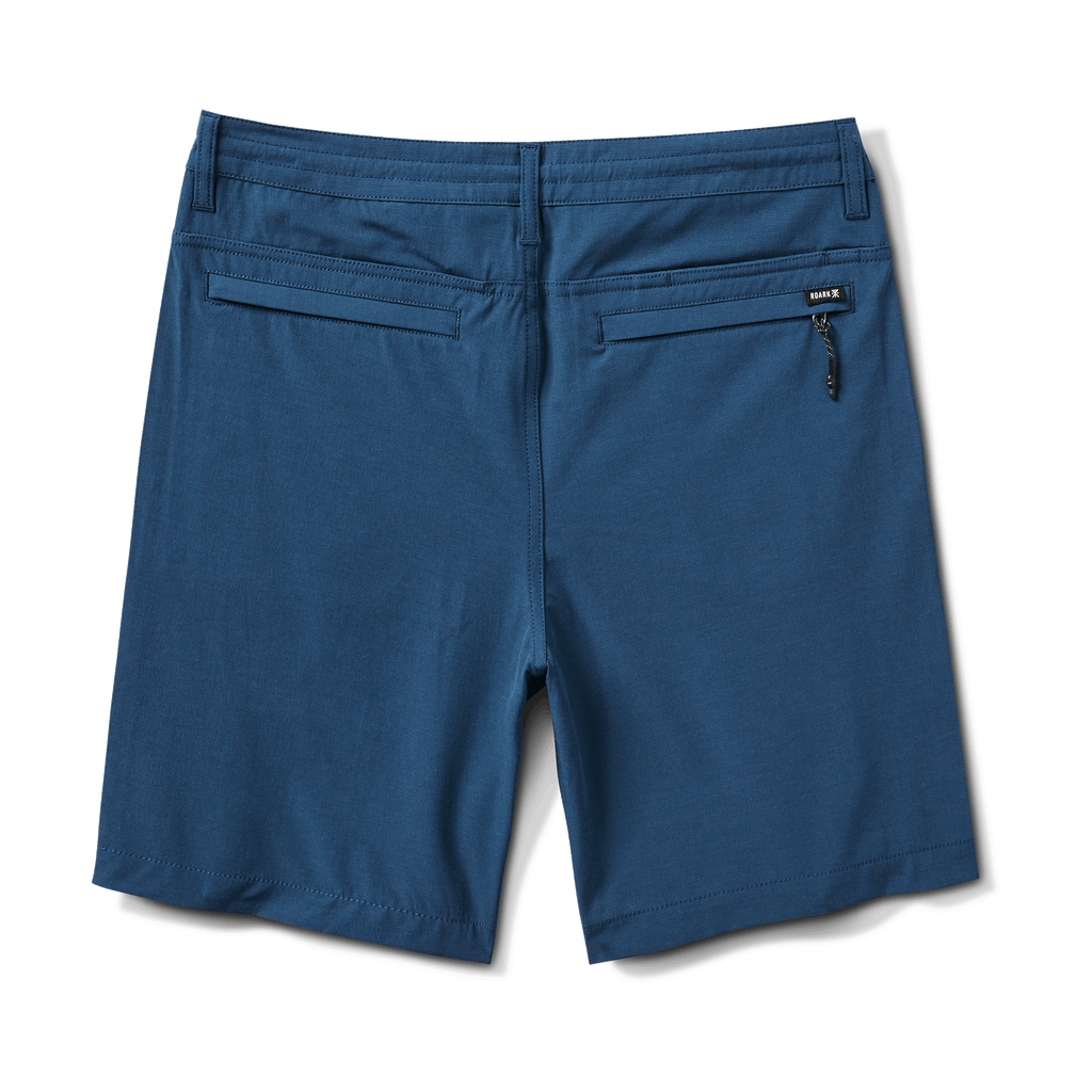 Back view of navy hybrid shorts with zippered back pockets for secure storage. Big Image - 2