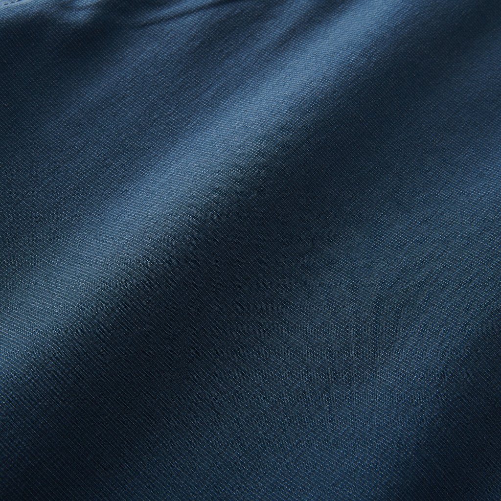 Fabric detail of navy hybrid shorts showcasing its smooth texture and high-quality material. Big Image - 11