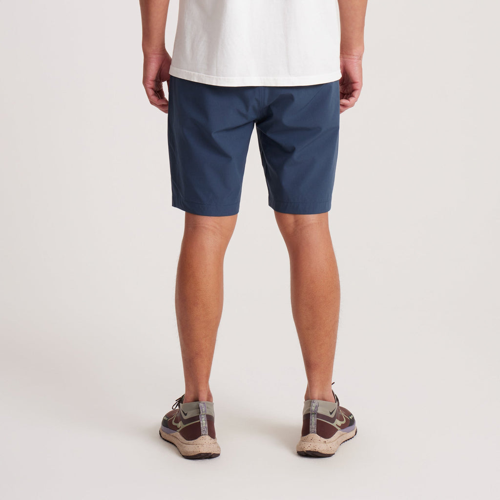 Back view of navy hybrid shorts highlighting zippered pockets and durable fabric for style and practicality. Big Image - 6