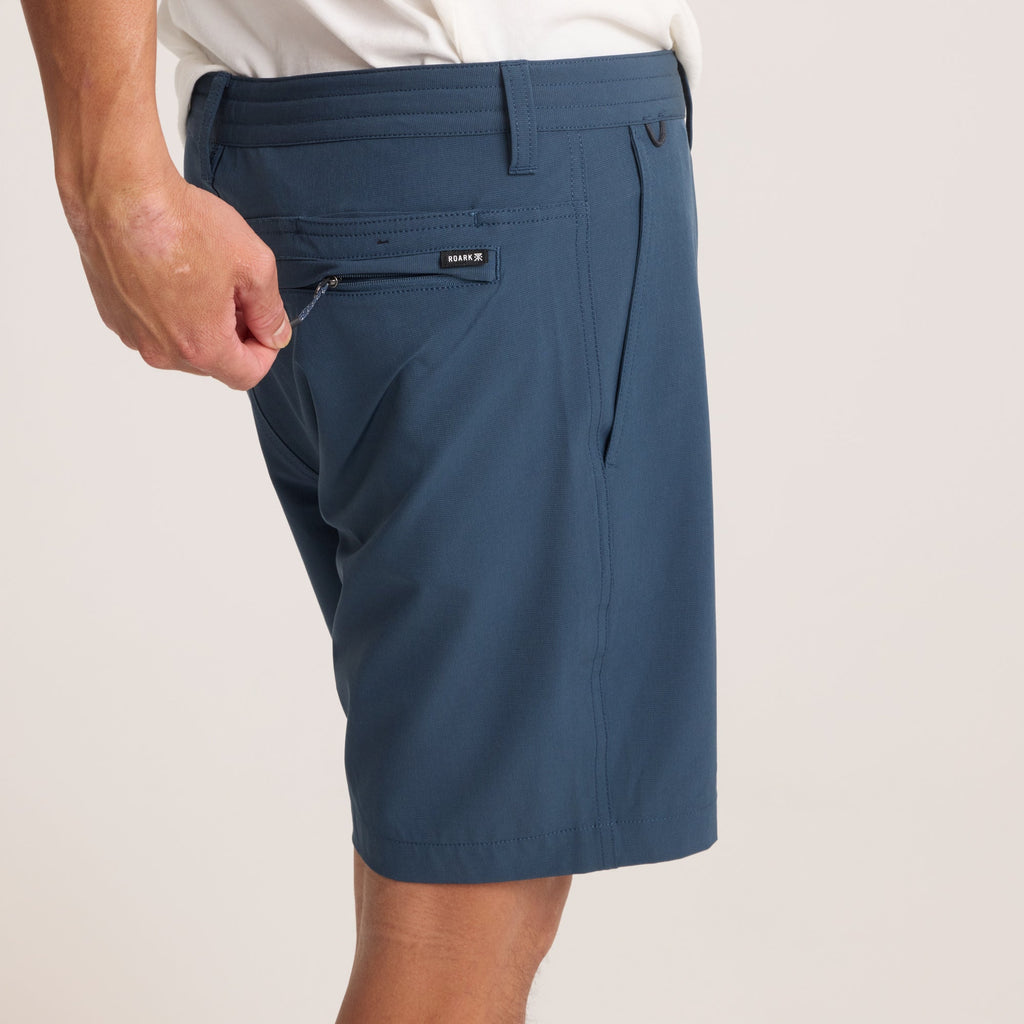 Close-up of navy hybrid shorts on a model, emphasizing premium fabric and clean finish for a modern aesthetic. Big Image - 7