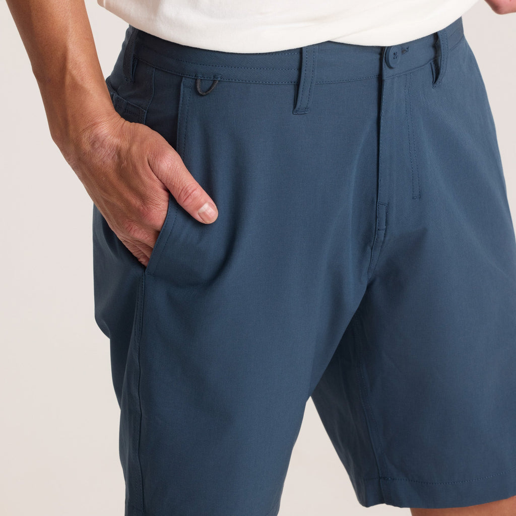 Close-up of navy hybrid shorts’ waistband and button detail, emphasizing precision stitching and quality craftsmanship. Big Image - 9