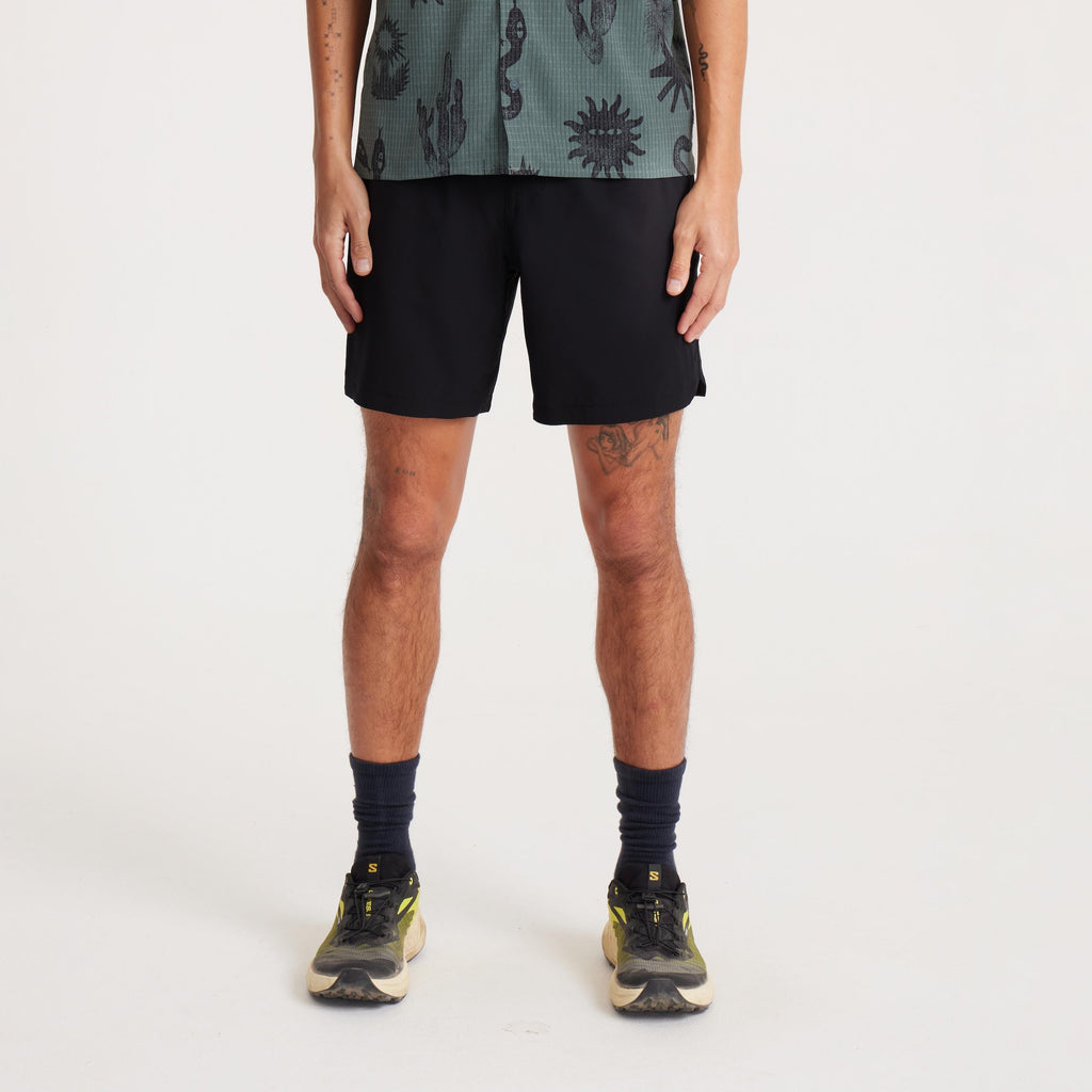 Model wearing black Serrano athletic shorts, front view, showcasing the versatile design perfect for trail running, workouts, or casual activities. Big Image - 2