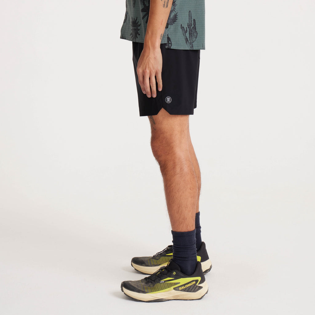 Side profile of model wearing black Serrano shorts, emphasizing the lightweight design and iconic Roark logo detail. Big Image - 4