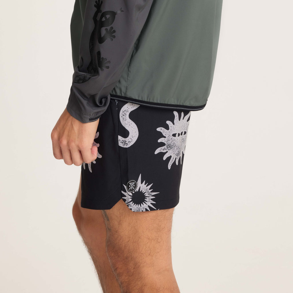 Close-up side view of black swim shorts, highlighting pocket details and bold graphic designs, ideal for comfort and style during outdoor activities. Big Image - 8