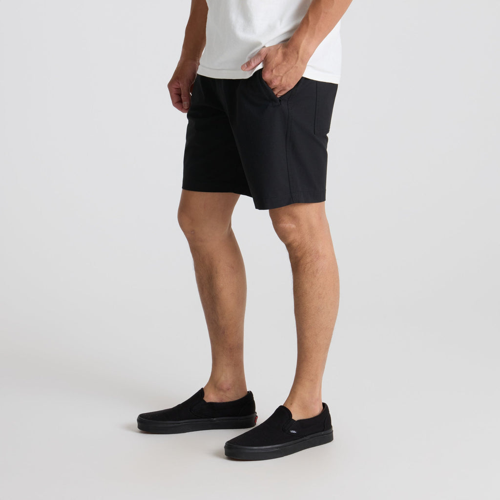 Close-up of black Roark adventure shorts showcasing the fit from calf to thigh, ideal for outdoor activities. Big Image - 5