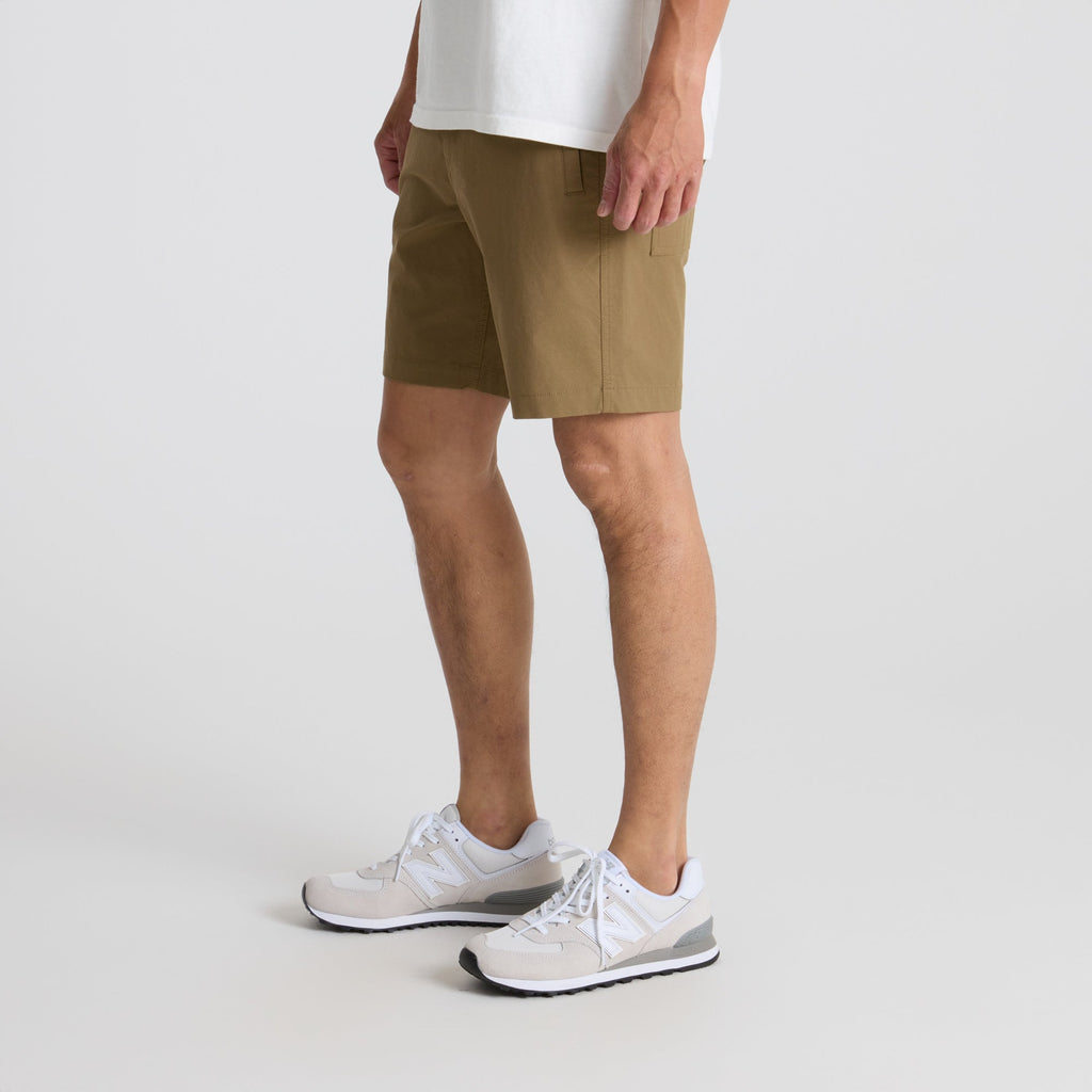 Man exploring scenic outdoor trails, wearing Roark's versatile active shorts paired with walking shoes, emphasizing comfort and durability in adventure gear. Big Image - 4