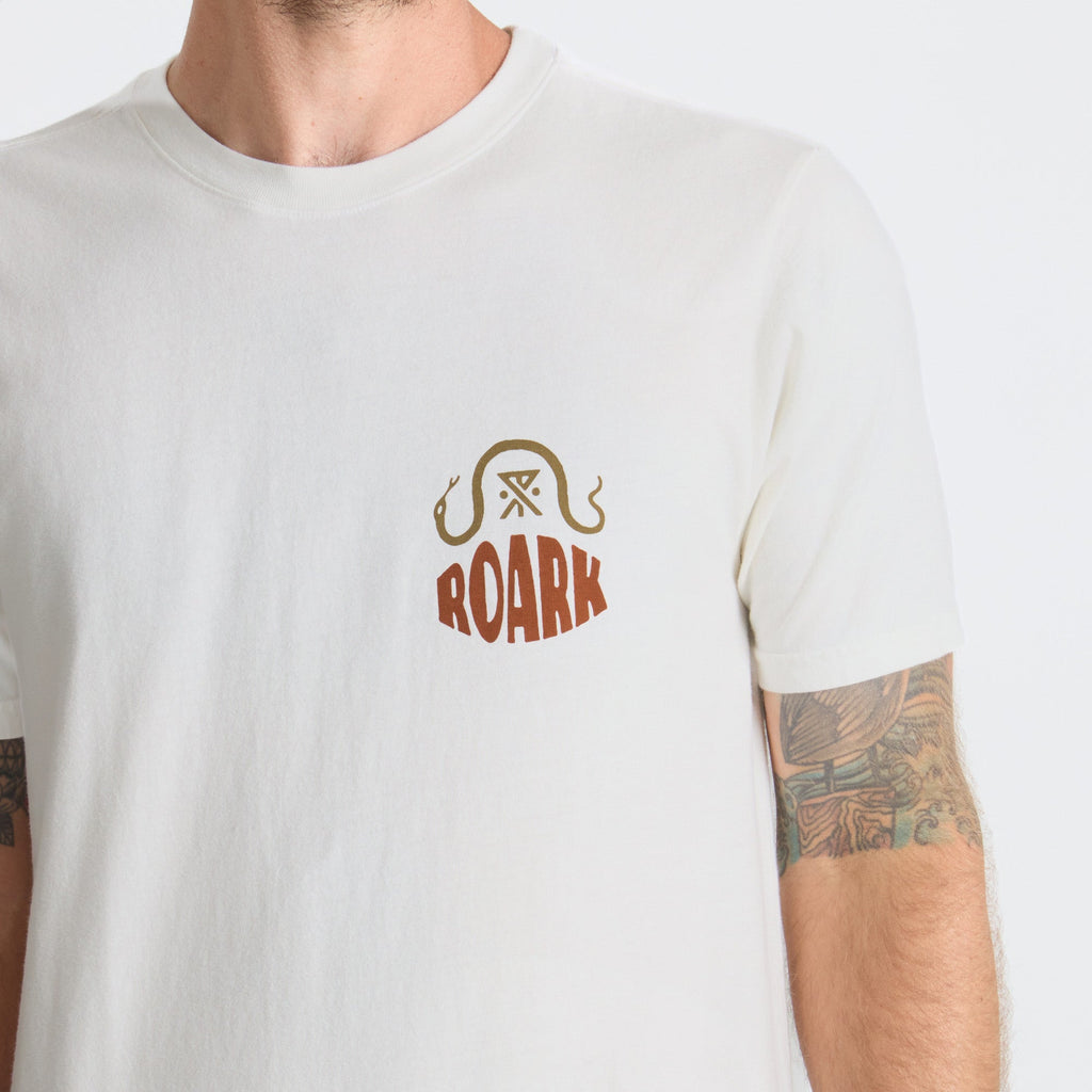 Man wearing a Roark active shirt while exploring rugged outdoor terrain, exemplifying adventure and endurance. Big Image - 6