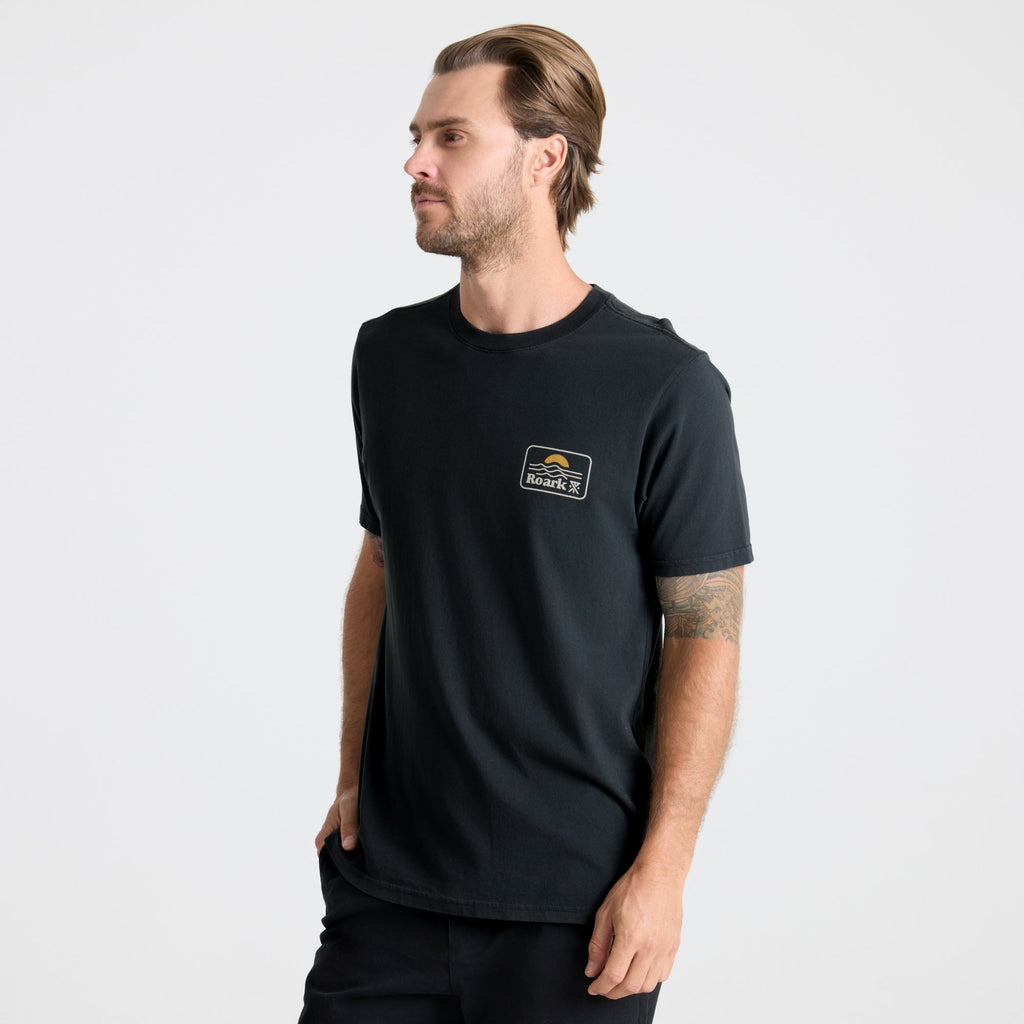 Close-up of a black active shirt featuring durable sleeves, designed for outdoor adventures and travel, by Roark. Big Image - 3