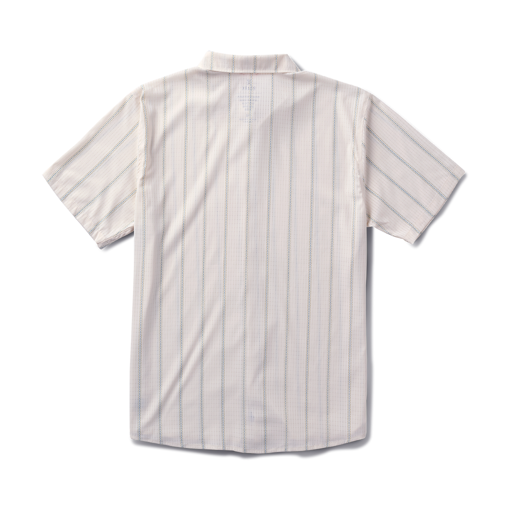 Close-up of a white Roark dress shirt featuring a detailed collar and buttons, designed for adventure and travel. Big Image - 7