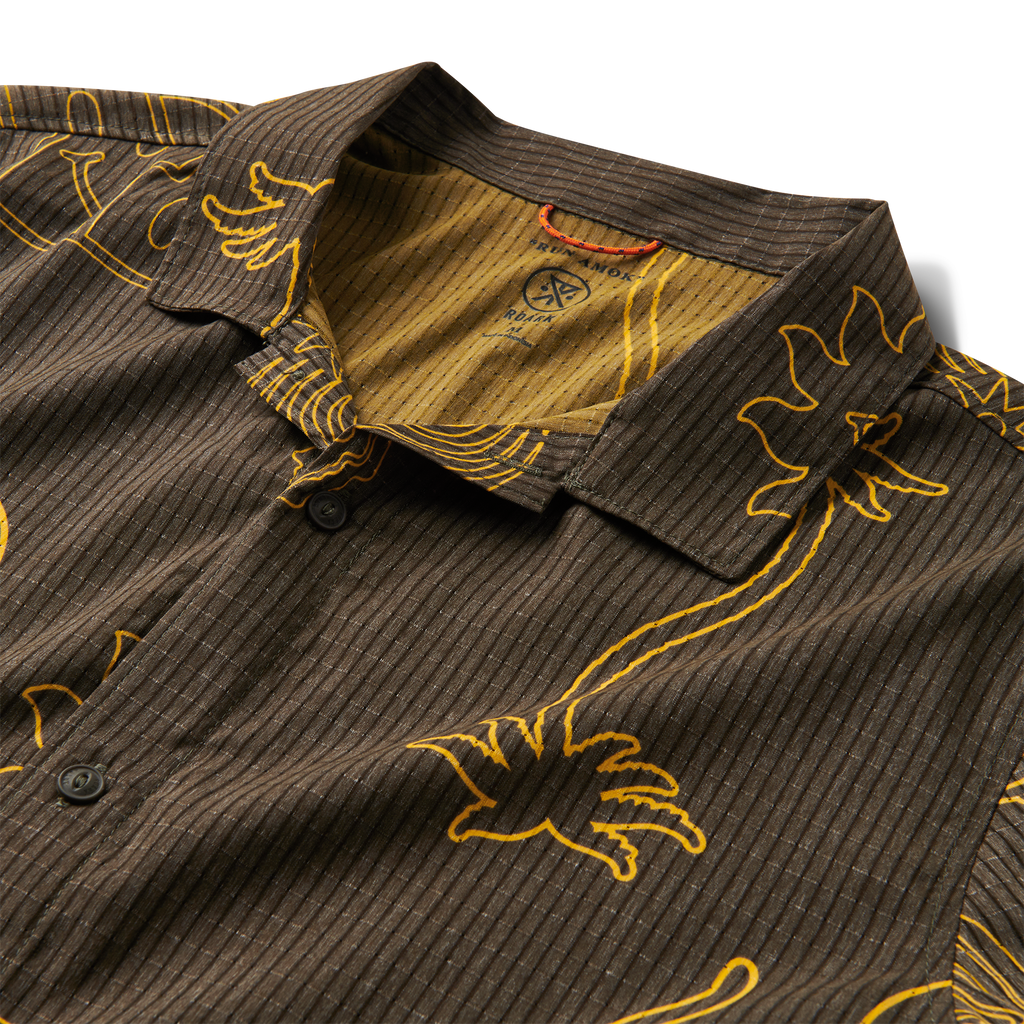 Brown short-sleeve button-up shirt with yellow abstract graphics, including palm trees, snakes, and suns, for a bold and playful style. Big Image - 3